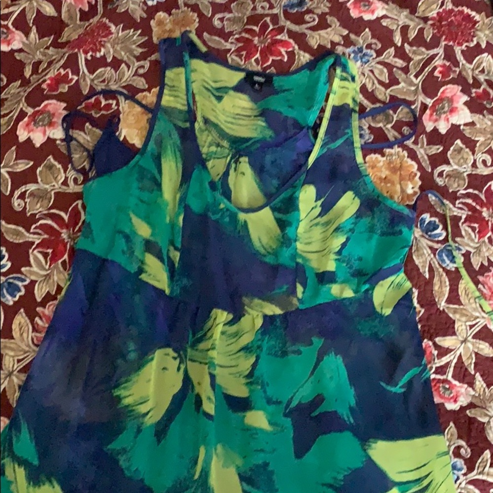 Long, bright sundress with blue slip.
